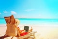 Remote work concept -young woman with laptop on beach Royalty Free Stock Photo