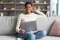 Remote Work. Portrait Of Happy Black Woman Sitting On Couch With Laptop Royalty Free Stock Photo