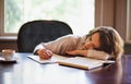 Remote work, sleeping and tired woman with books, fatigue or snooze while writing in home office. Freelance, burnout or Royalty Free Stock Photo