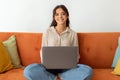 Remote Work. Smiling Beautiful Woman With Laptop Computer Sitting On Couch At Home Royalty Free Stock Photo