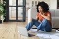 Remote Work. Young Black Woman Working With Laptop And Documents At Home Royalty Free Stock Photo