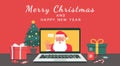 Santa Claus hand greeting via video calling on the laptop with Merry Christmas and happy new year lettering