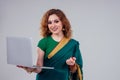 Remote working concept dream job.beautiful and young indian businesswoman green stylish sari working with a laptop while