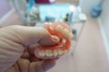 Removable denture in the hands of a doctor Royalty Free Stock Photo
