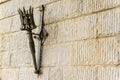 Removable iron torch on a medieval castle stone wall Royalty Free Stock Photo