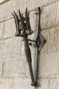 Removable iron torch on a medieval castle stone wall Royalty Free Stock Photo