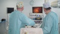 Removal of malignant tumor in the prostate. Resection of the prostate. Surgeons team hands during laparoscopic abdominal operation