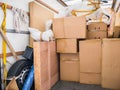 A removal van and cardboard boxes and packing materials. Royalty Free Stock Photo