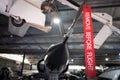 Remove Before Flight red ribbon hanging off fighter jet in hangar.