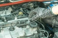 Remove high-tension lead from ignition coil and checking spark plug, Auto mechanic maintenance ignition system Royalty Free Stock Photo