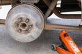 Remove wheel by car jack for repair.