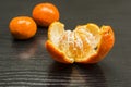 Removed peel from the ripe fruit of a sweet mandarin. Royalty Free Stock Photo