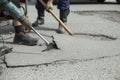 He removes the asphalt with a jackhammer. Removing the asphalt layer from the road