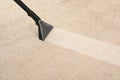 Removing dirt from carpet with vacuum cleaner Royalty Free Stock Photo