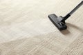 Removing dirt from light carpet with vacuum cleaner Royalty Free Stock Photo