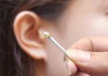 Removing ear wax Royalty Free Stock Photo