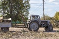 Removing fallen tree with tractor and loader Royalty Free Stock Photo