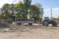 Removing fallen tree with tractor and loader Royalty Free Stock Photo