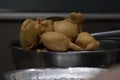 removing fried iNDIAN SUBCONTINENT FOOD PAKORA ,ALOO BHAJIYA from oil