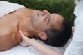 Removing his tension one knot at a time. a handsome man enjoying a massage. Royalty Free Stock Photo