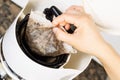 Removing old coffee filter from coffee machine Royalty Free Stock Photo