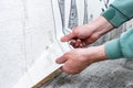 Removing old wallpaper from the wall. Royalty Free Stock Photo