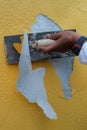 Removing paint with stainless steel plastering trowel