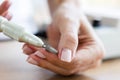 Removing shellac from the nails with fraser. Closeup. Selective focus.