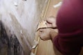 Removing the skirting board before removing old wallpaper and painting wall. Preparing for renovation of the flat. Close Royalty Free Stock Photo