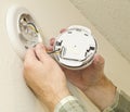 Removing Smoke Detector To Change The Battery Royalty Free Stock Photo