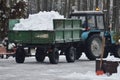 removing snow with a tractor