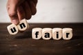 Removing two blocks with letters to change the word unfair to fair