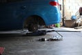 Removing wheels, repairing suspension, wheels and tires in the repair shop