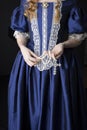 Renaissance century woman in a blue silk gown