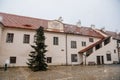 Renaissance courtyard, Baroque medieval castle with stone gothic tower, historical building on the Otava, snow in winter day,