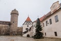 Renaissance courtyard, Baroque medieval castle with stone gothic tower, historical building on the Otava, snow in winter day,