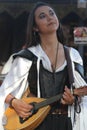 Musicians dressed in Medieval costumes at a renaissance faire Royalty Free Stock Photo