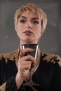 Renaissance fashion woman holding goblet with wine Royalty Free Stock Photo