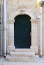 Renaissance front door with marble frame Royalty Free Stock Photo