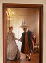 Renaissance, man and woman holding hands in royal castle together with vintage love, romance and banquet. Medieval king Royalty Free Stock Photo