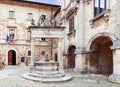 Renaissance marble well Pozzo dei Grifi e dei Leoni on the Piazza Grande in Montepulciano, Tuscany, Italy Royalty Free Stock Photo