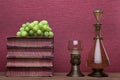 Renaissance, rummer wine glass, bottle, old books and grapes