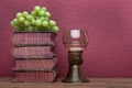 Renaissance, rummer wine glass, old books and grapes