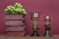 Renaissance, rummer wine glass, old books and grapes