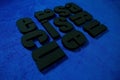 Renaissance text, extruded polystyrene letters painted in black paint. on a dark blue background. blank for decoration, logo makin