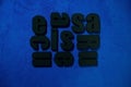 Renaissance text, extruded polystyrene letters painted in black paint. on a dark blue background. blank for decoration, logo makin