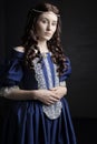 Renaissance woman in blue silk dress