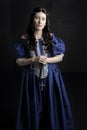 Renaissance woman in blue silk dress