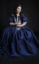 Renaissance woman in blue silk dress