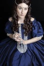 Renaissance woman in blue silk dress